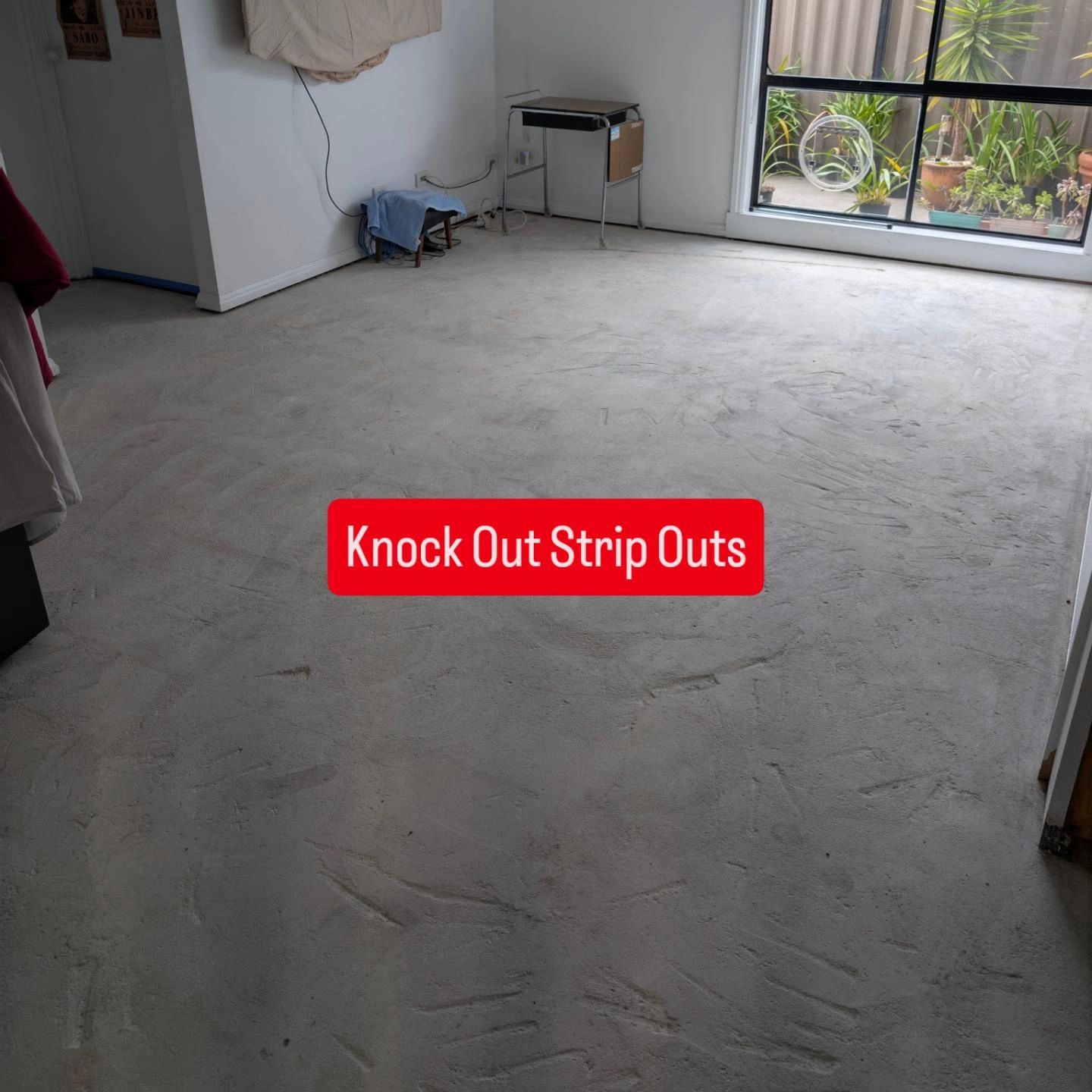 Empty room with concrete floor after strip-out