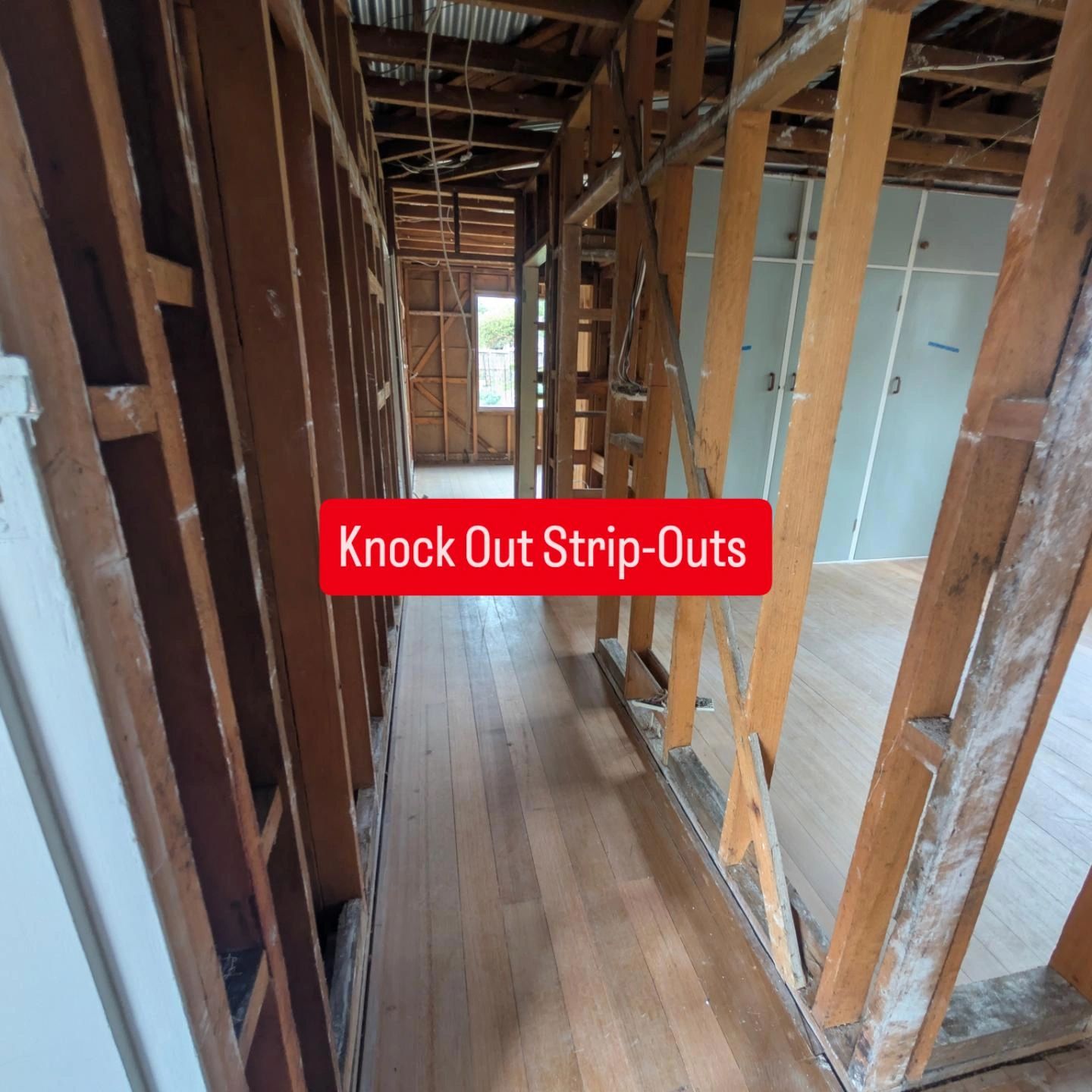 Hallway renovation with exposed wooden framing