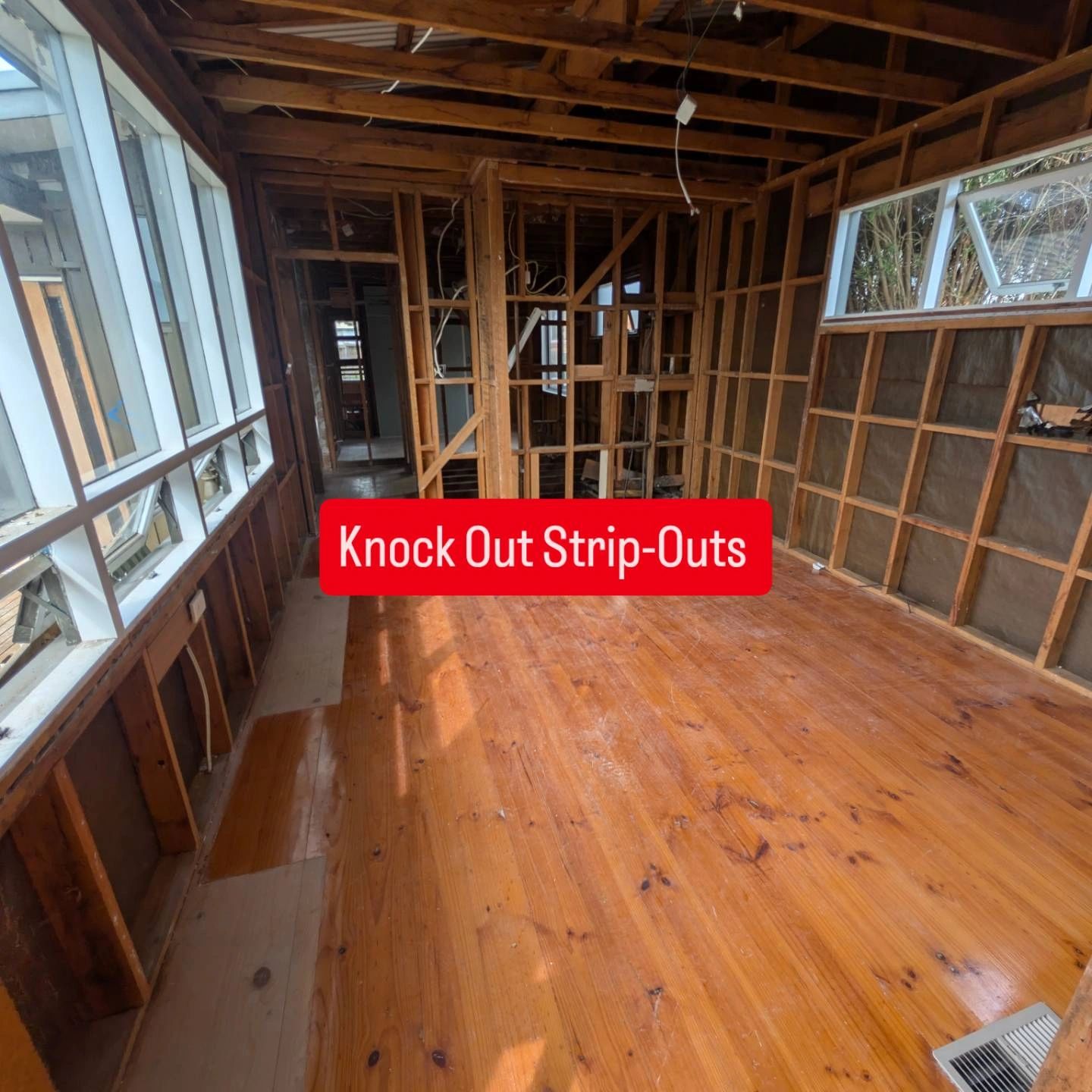 Sunroom renovation with exposed framing and windows