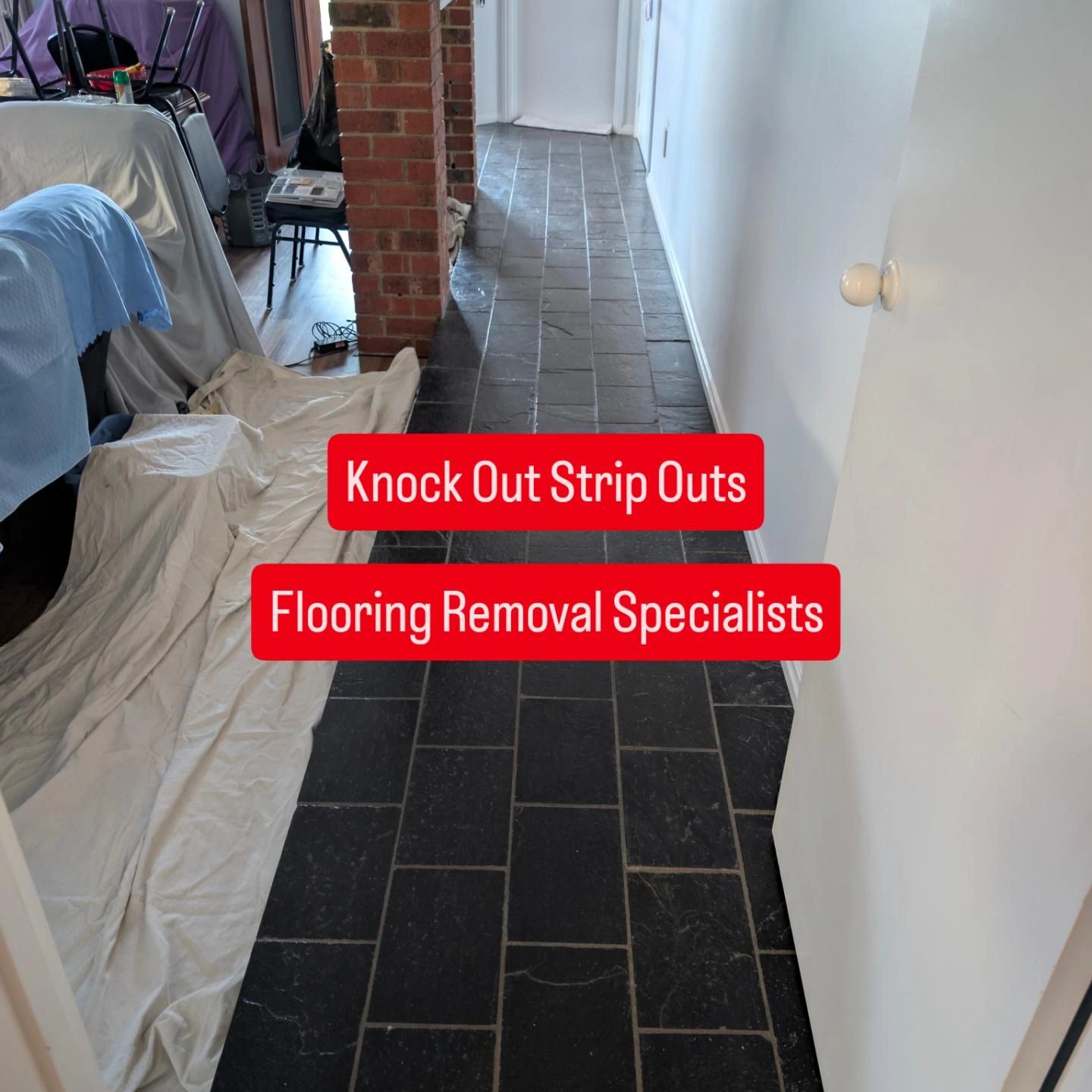 Flooring removal in progress — hallway with tile floor